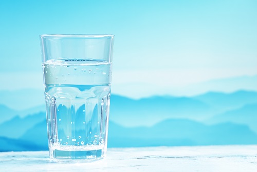 Mineral water against mountain landscape
