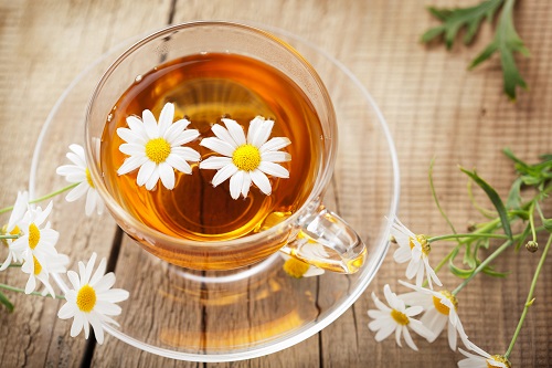 cup of herbal tea with chamomile flowers