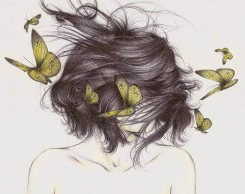 mulher-com-borboletas-pensando-no-que-precisa-deixar-ir
