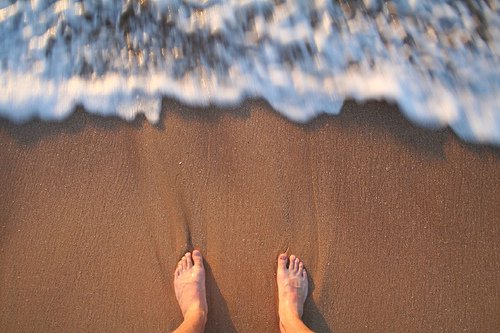 Pés na areia