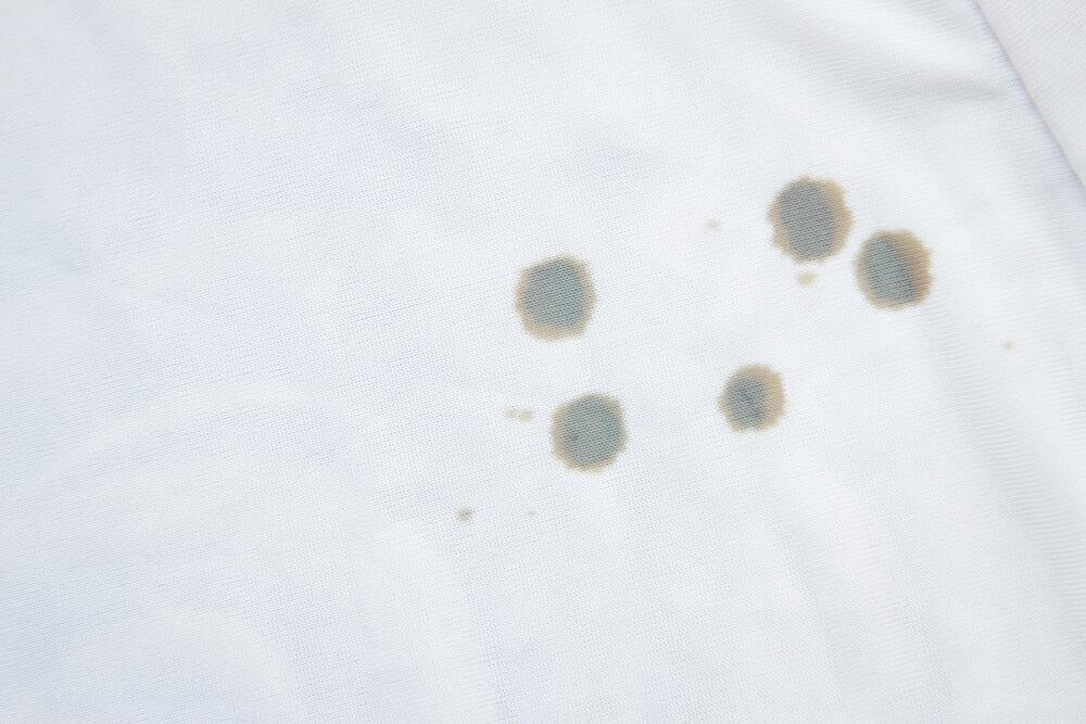 Manchas de óleo na roupa